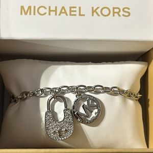 Michael Kors silver padlock bracelet.